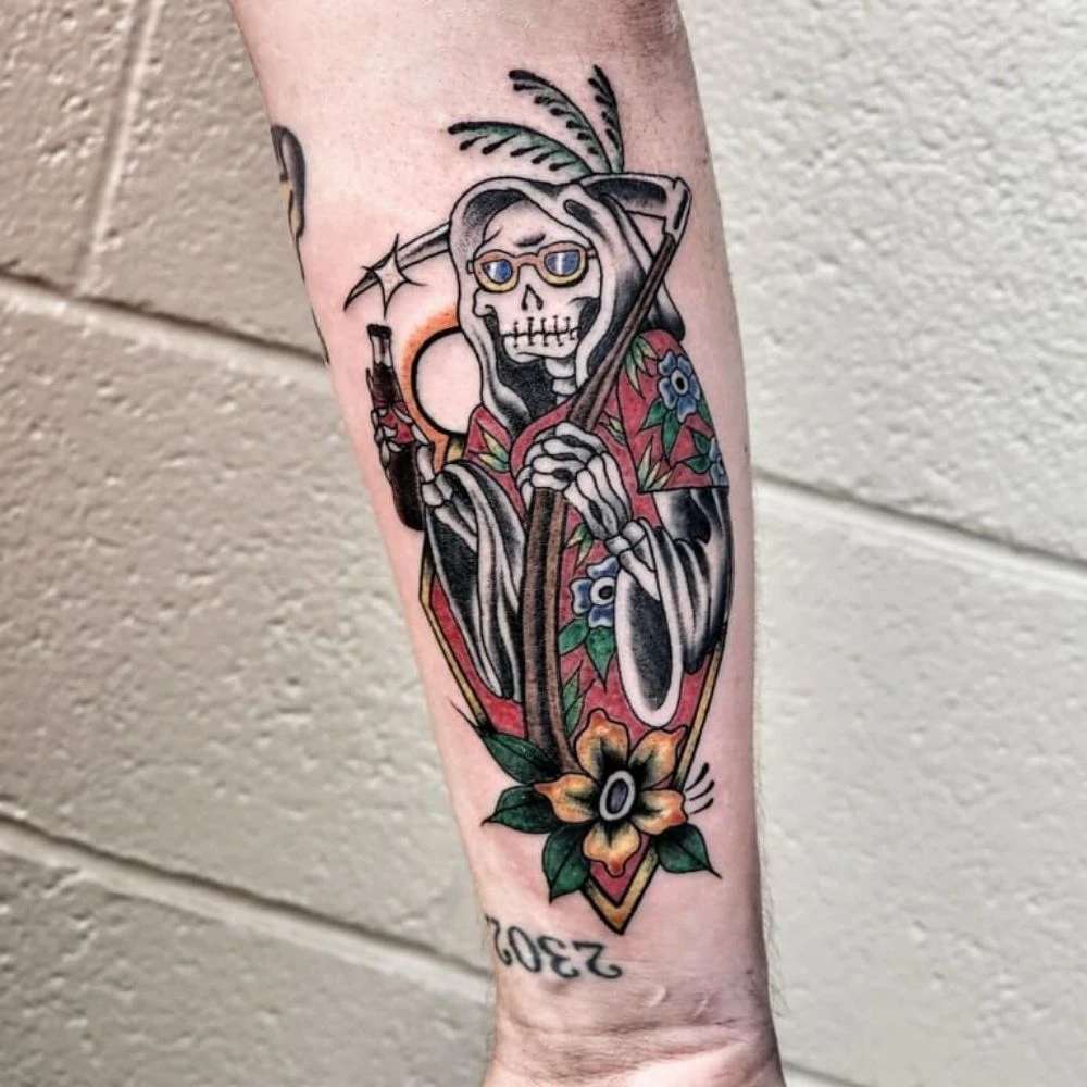 Traditional grim reaper arm tattoo