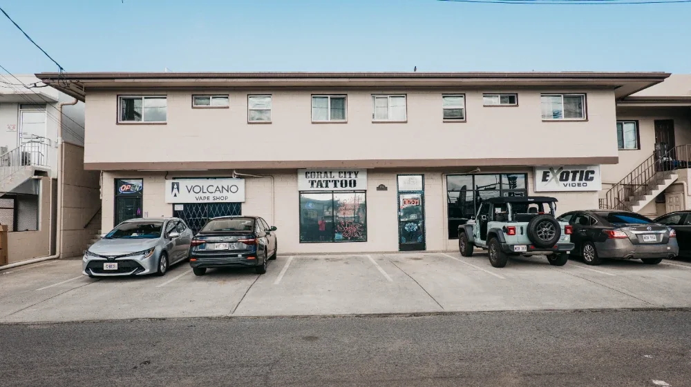 Coral City Tattoo — center unit on Kanakanui Street, between Volcano Vape Shop and Exotic Video